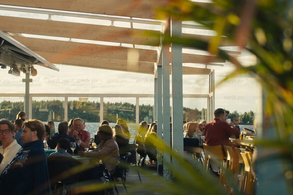 Luleå city center waterfront outdoor dining with friends and family on a sunny day