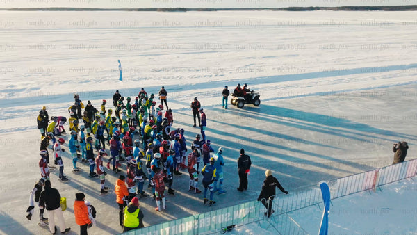 Winter ice skating competition in Luleå: Drone footage of athletes on frozen track