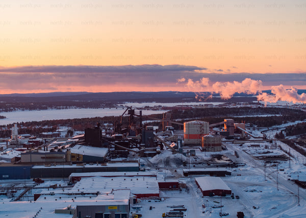 Industrial landscape in winter during sunset viewed by drone