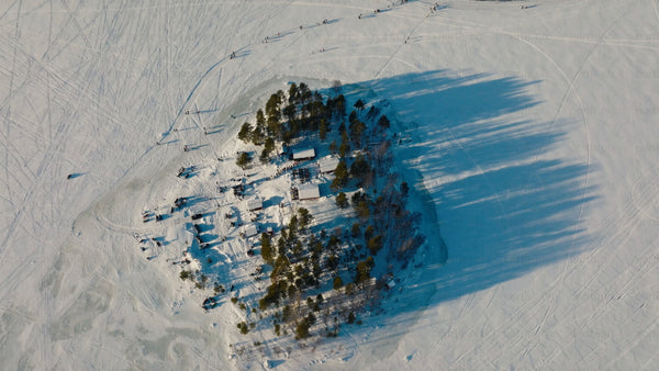Winter wonderland in Luleå: Aerial view of snowy island gathering
