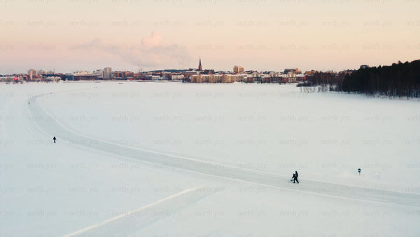 Winter wonderland in Luleå: Skiing on a frozen lake at sunset