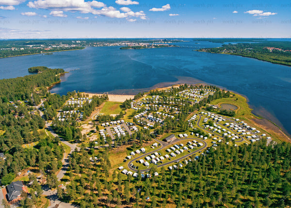 Aerial view of Luleå campground by the water on a bright summer day