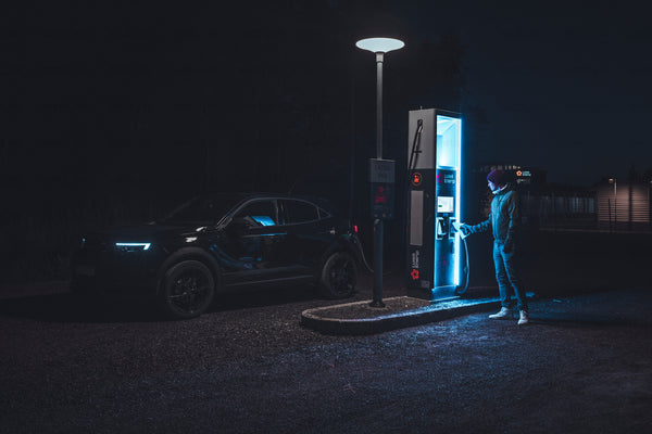 Electric car charging at Luleå station at night