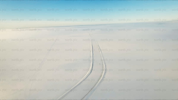 Snowmobile on ice road in Luleå archipelago, winter day