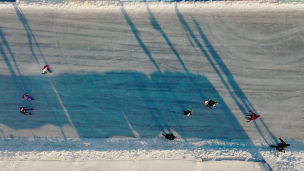 Winter ice skating in Luleå: Drone footage of athletes on a bright day