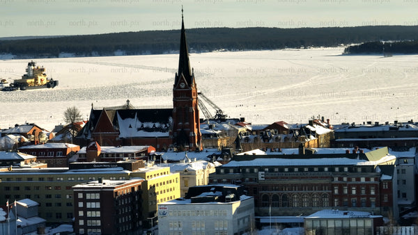 Winter day in Luleå: Aerial view of frozen river and cathedral