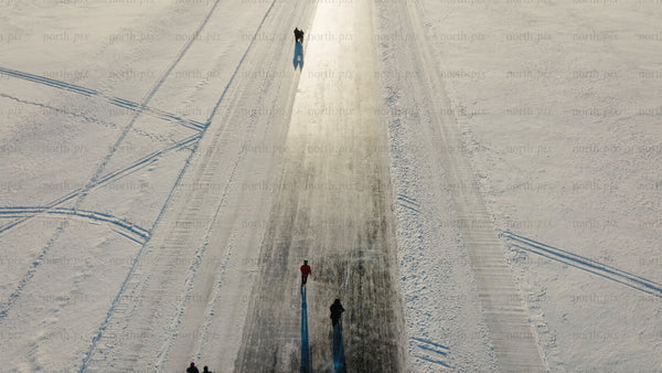 Ice skating and kicksledding on a frozen road in Luleå