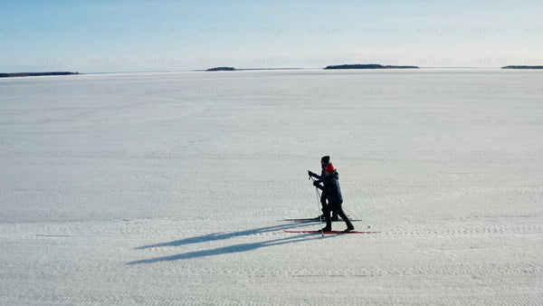 Winter cross-country skiing on frozen lake in Luleå – drone view