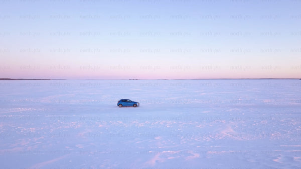 Winter sunset drive on a frozen ice road in the Luleå archipelago