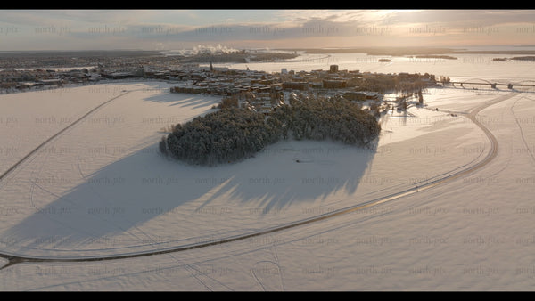 Winter sunset over Luleå: An aerial drone view of the snowy Swedish city