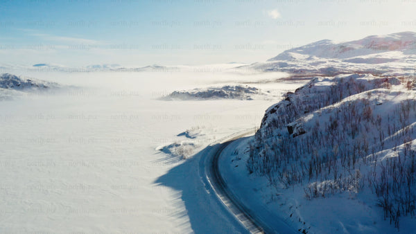 Aerial drone view of snowy road in Riksgränsen mountains