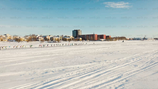 Ice skating on a frozen lake in Luleå - winter drone footage