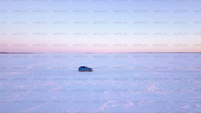 Winter sunset drive on a frozen ice road in the Luleå archipelago
