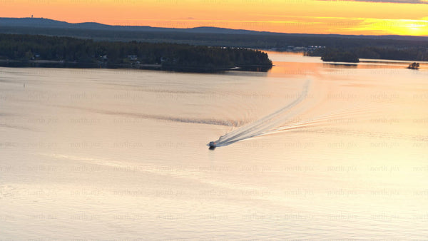 Summer sunset boat trip on Luleå river: Aerial view of scenic landscape