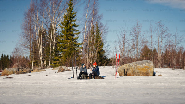 Winter break: Skiers enjoying warm drinks in snowy Luleå forest