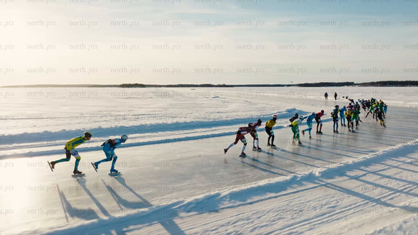 Speed skating on a frozen lake in Luleå, on a bright winter day
