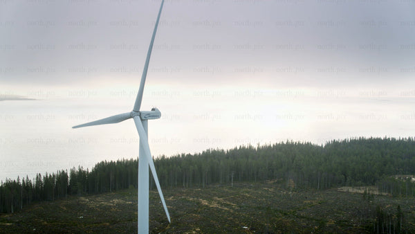 Rotating wind turbine on Haraholmen island, pori, Finland, aerial view in summer