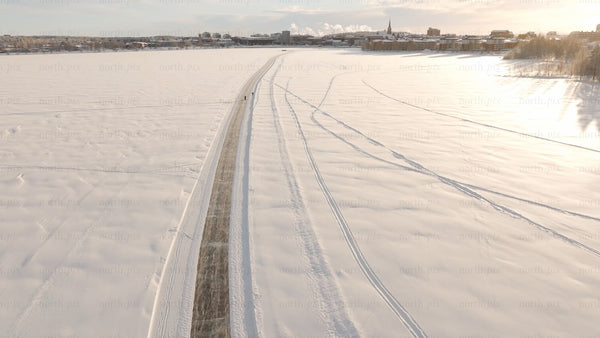 Winter wonderland in Luleå: Aerial view of frozen lake activities