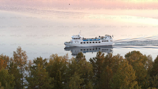 Luleå river sunset ferry: Aerial view of calm water and colorful sky