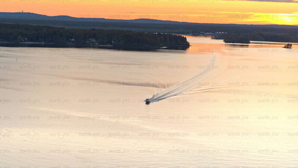 Summer sunset boat trip on Luleå river: Aerial view of scenic landscape