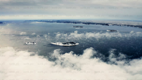 View of Piteå Haraholmen archipelago in winter with snowy islands and icy waters