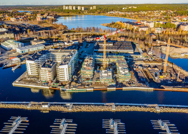 Aerial view of coastal construction site during autumn in Luleå
