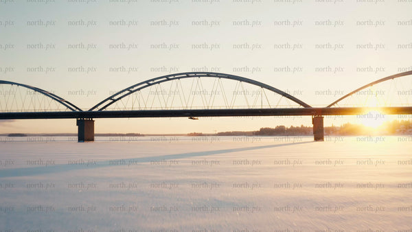 Winter sunset over bridge in Luleå: Aerial drone footage