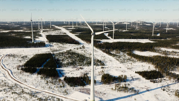 Markbygden wind farm: Aerial winter view of turbine in snowy landscape, renewable energy