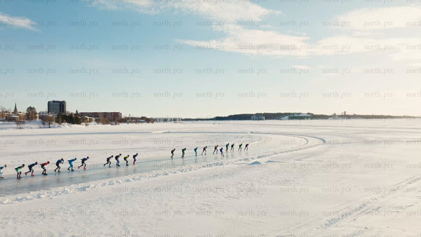 Winter ice skating in Luleå: Drone shot of group on frozen lake
