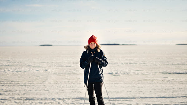 Winter cross-country skiing in Luleå archipelago: Woman enjoys scenic frozen landscape