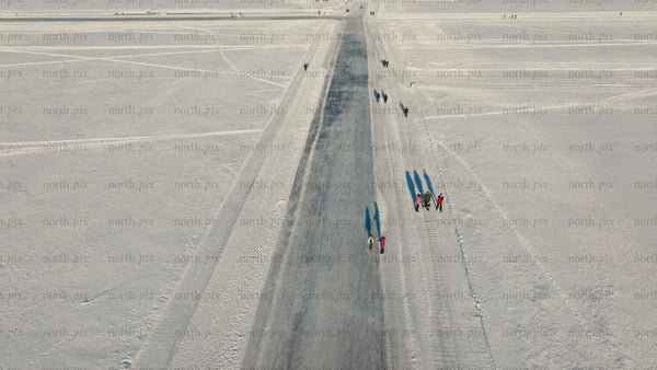 Aerial view of ice road on frozen lake near Luleå in winter
