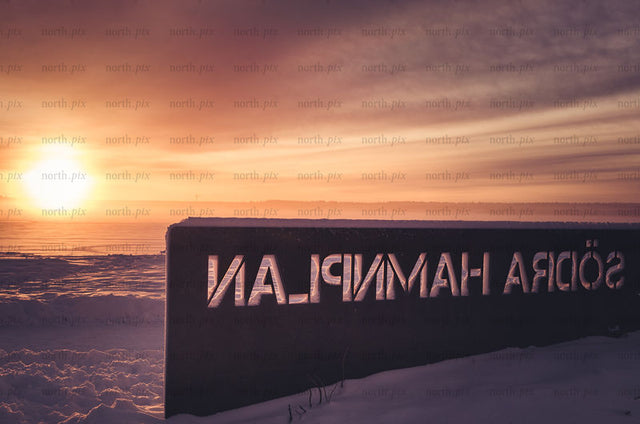 Södra Hamnplan waterfront sign at sunrise, winter