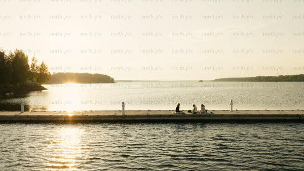 Summer sunset picnic on the dock in Luleå
