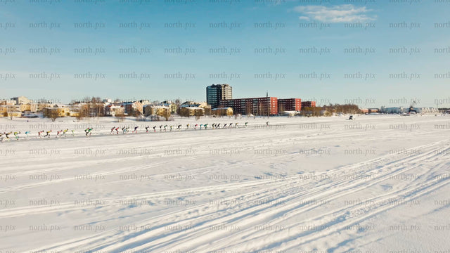 Ice skating on a frozen lake in Luleå - winter drone footage