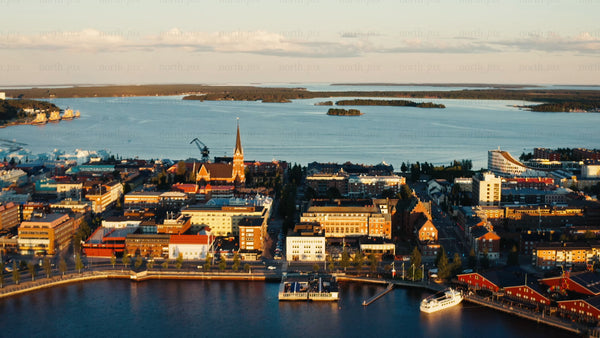 Luleå: A summer sunset aerial view of the city's waterfront and church