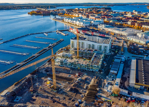 Autumn urban waterfront with construction site and aerial perspective over scenic Luleå