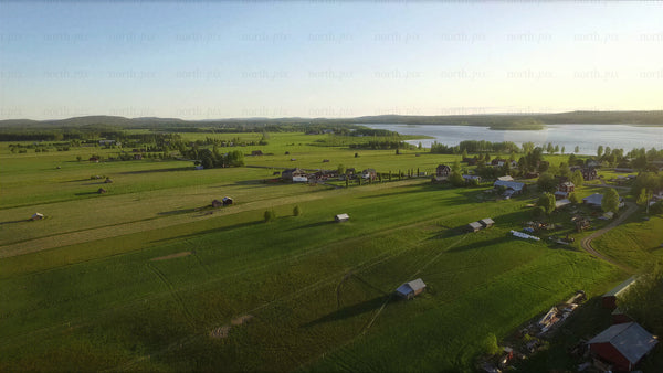 Drone flight over summer countryside and meadows in avan, Luleå