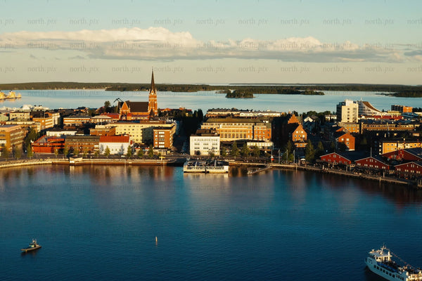 Luleå city center by the water: Sunset over the waterfront with church steeple