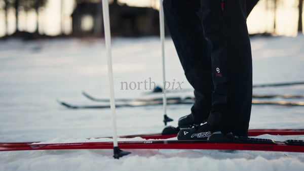 Skiers Preparing for Cross-Country Skiing in Luleå, Sweden at Golden Hour