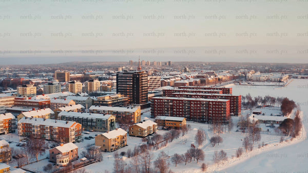 Winter sunrise over Luleå: A drone's-eye view of the snowy cityscape