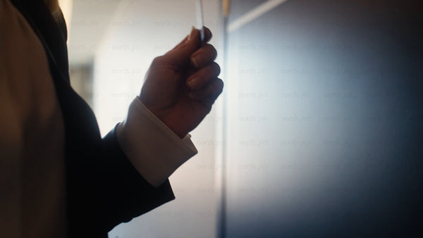 Businessman opens hotel room door with key card