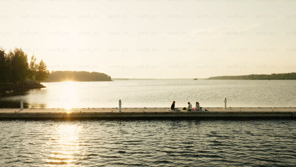 Summer sunset picnic on the dock in Luleå