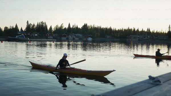 Kayaking in the Luleå archipelago at sunset during summer