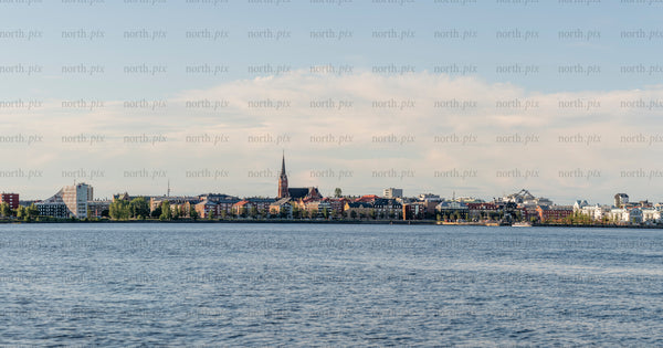 Panoramic waterfront city skyline in summer afternoon