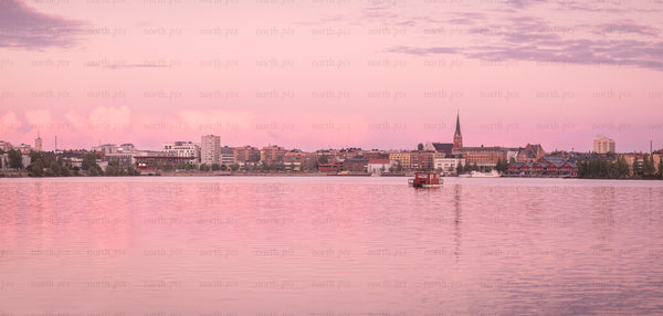 Panorama of waterfront town at sunset