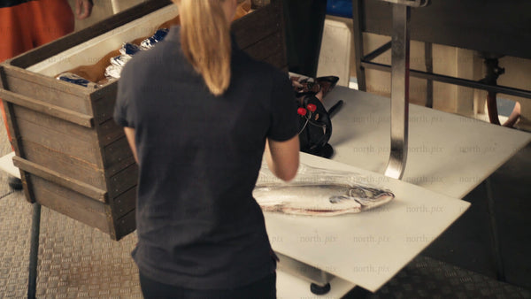Fresh salmon processing at a fish market