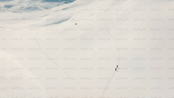 Skiers on snowy mountain slope in riksgransen, Sweden