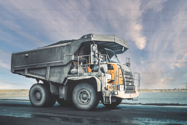 Large mining dump truck on road in daytime