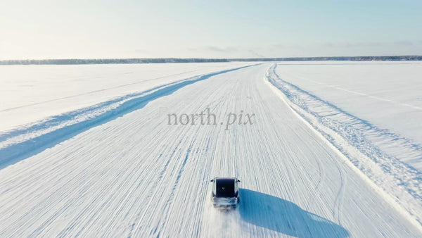 Tesla/Car Winter Driving on Frozen Ice Road in Luleå, Sweden - Drone Footage