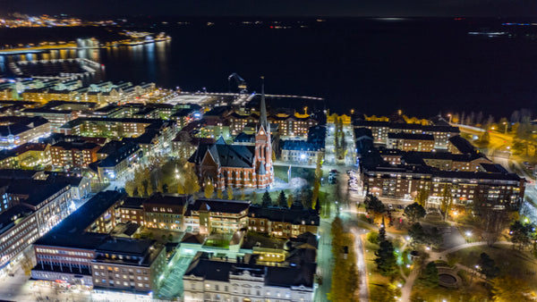 Aerial hyperlapse of Luleå city center at night: Luleå cathedral and Norrbotten county